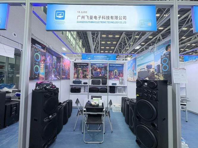 PHMAX exhibition booth displaying speakers and headsets